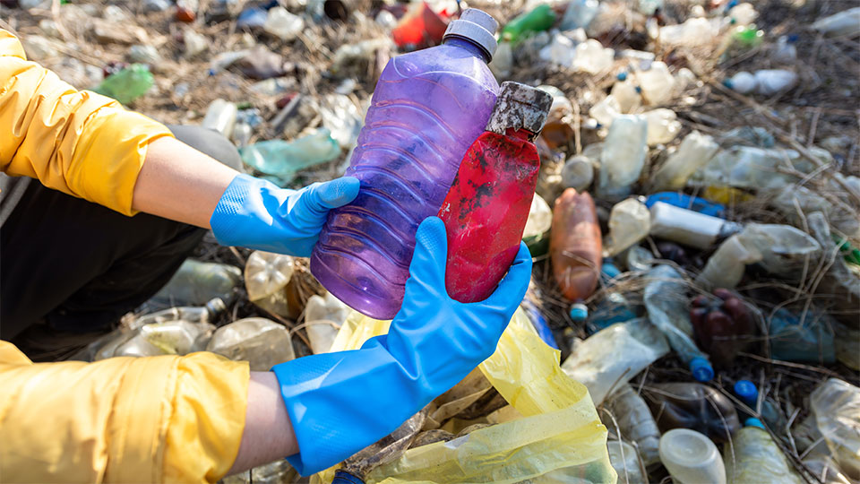man--scattered-plastic-bottles-from-ground.jpg